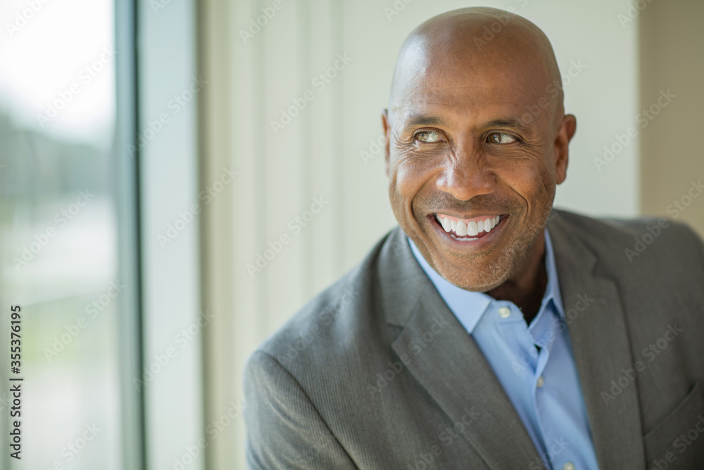 Happy mature African American man at work. Happy mature African American man at work.