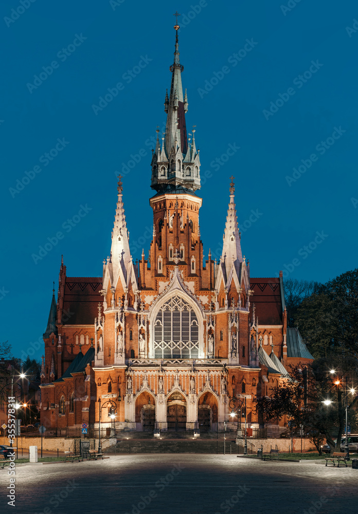 Obraz premium St. Joseph's Church in Podgórze district of Krakow, Poland at night.