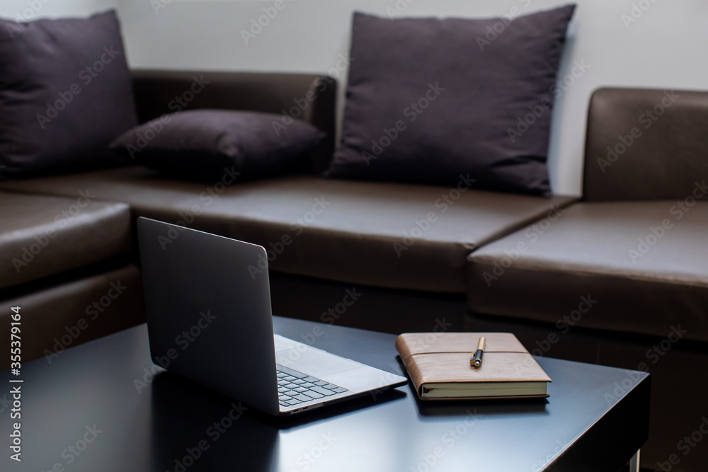 Fototapeta premium sofa work from home macbook notebook