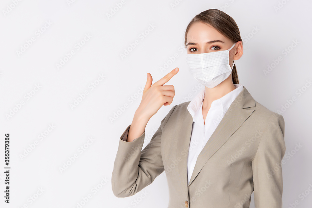 Beautiful woman with light brown suit and wearing mask Beautiful woman with light brown suit and wearing mask