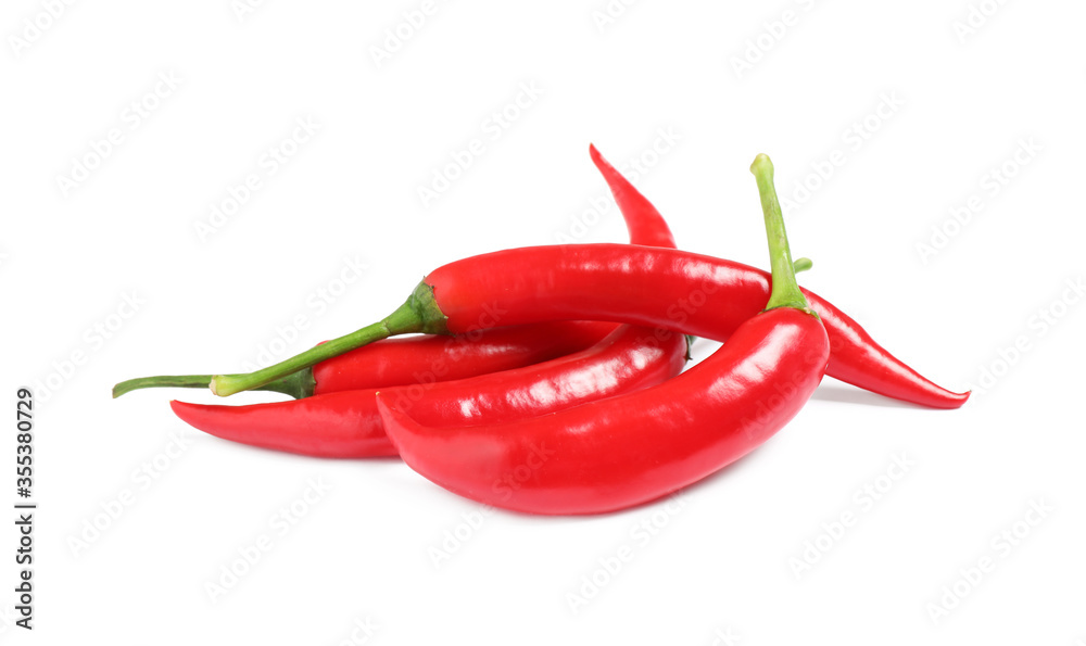 Ripe red hot chili peppers isolated on white