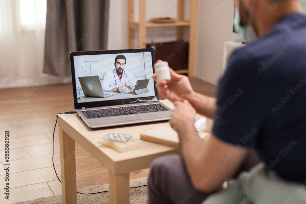 Rear view of patient in a video call during quarantine. Rear view of patient in a video call during quarantine.