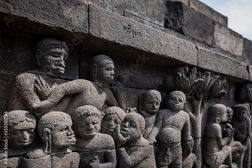 The stories from Mahayana Buddhist Sutras carved on the relief panels of Borobudur Temple (750AD) photo