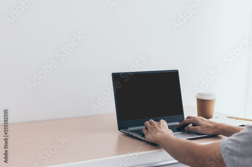 Businessman working or using laptop or computer for e-business at home. Student reading, learning & studying online webinar course or classroom via internet connection network. Business and Education