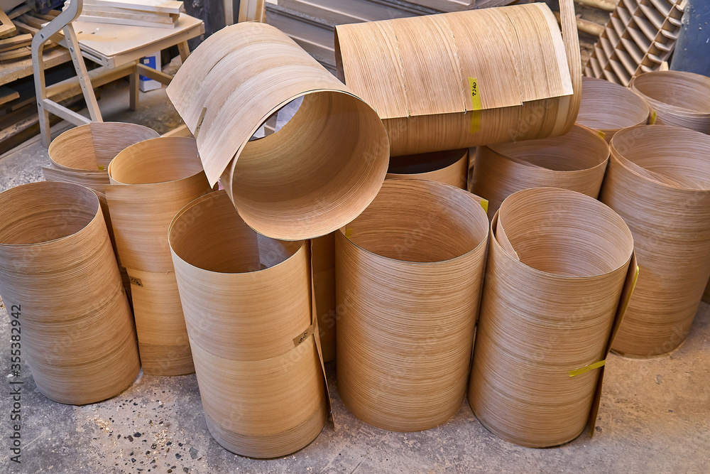 Oak veneer roll. Wood texture. Furniture manufacture. Close-up Oak veneer roll. Wood texture. Furniture manufacture. Close-up