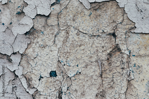 Old peeling blue painted wall. Close up
