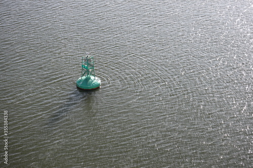 Solitary buoy in the middle of the sea