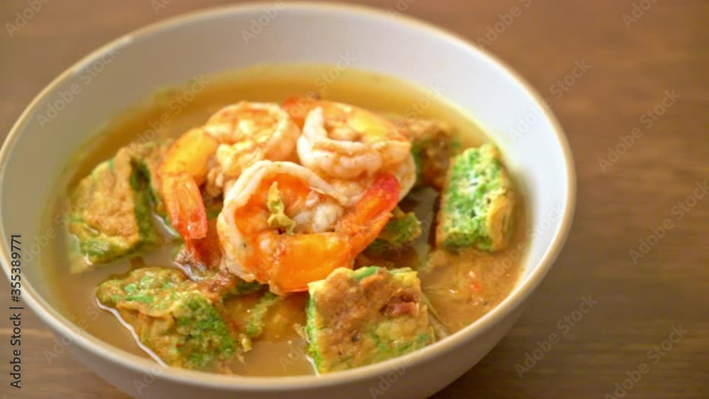 Sour soup made of Tamarind Paste with Shrimps and Vegetable Omelet - Asian food style