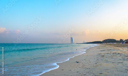 фотография Beautiful landscape of Al Sufouh Beach, one of Dubai's hidden gems, also known as “Secret Beach and Black Palace Beach with iconic Burj Al Arab in the background