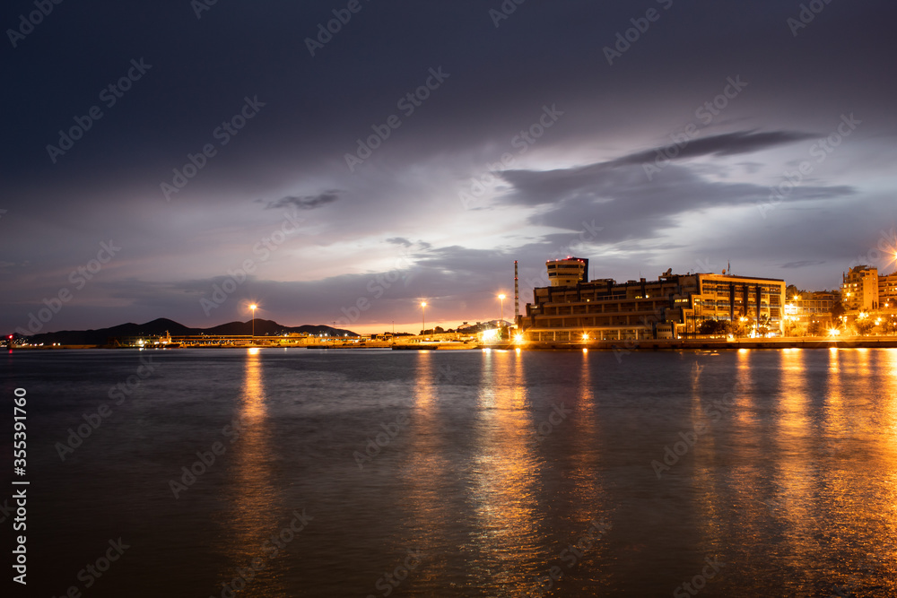 Buildings of Piraeus port in twilight