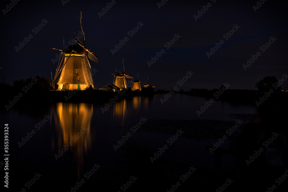 Mills at Kinderdijk (The Netherlands) in the evening illuminated