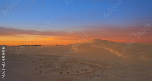 a beautiful sunset over the sand dunes