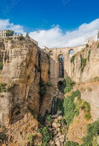 Ronda panoramic view of village with bridge the Puente Nuevo in the background, Andalusia, Malaga, Spain.