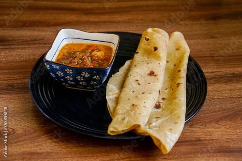 Chapati with chicken curry mix with sardine sambal.