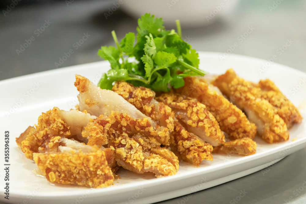 Crispy pork belly or deep fried pork with sweet sour sauce or black soya sauce. Crispy pork belly or deep fried pork with sweet sour sauce or black soya sauce.