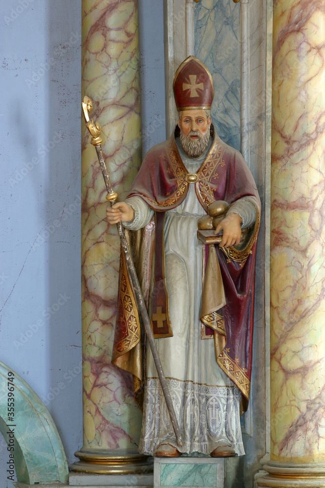 Fototapeta premium St. Nicholas bishop statue on the main altar in the Church of the Annunciation of the Blessed Virgin Mary in Klanjec, Croatia