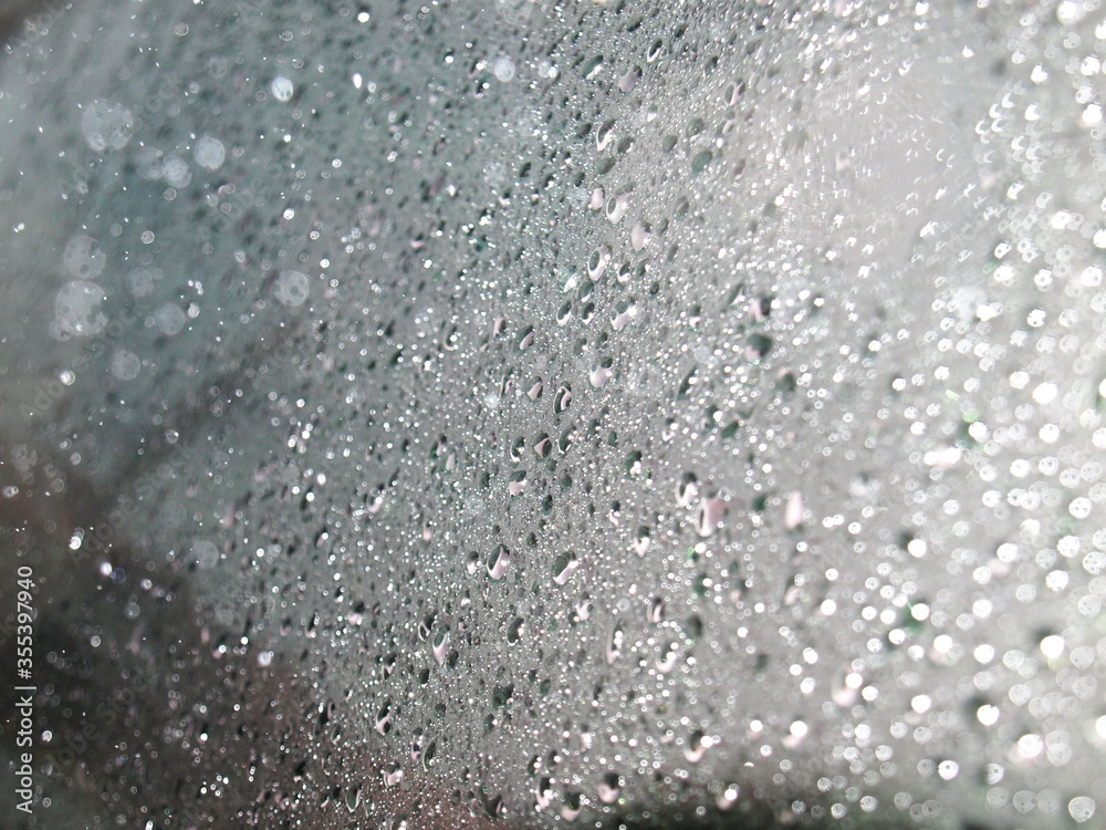Background or texture of raindrops on a blurred car glass With reflection resulting from using flash For background work. Background or texture of raindrops on a blurred car glass With reflection resulting from using flash For background work.