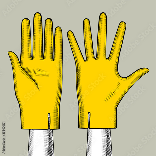 Hand with yellow gloves