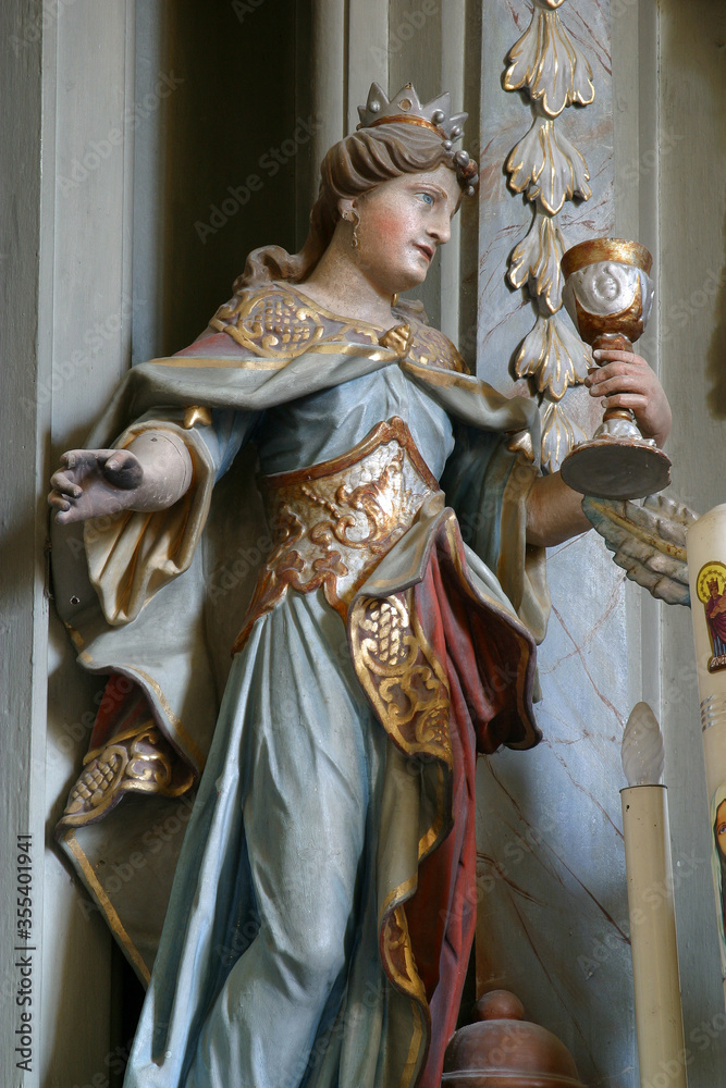 Obraz premium St. Barbara statue on the main altar at St. Catherine of Alexandria Church in Samarica, Croatia