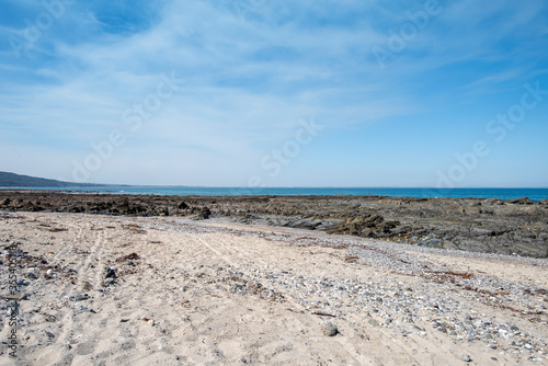 Empty Large Rocky Coastal Seaside Scene and Beach on a Sunny Day