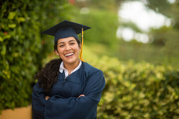 Young hispanic female graduate at her graduation