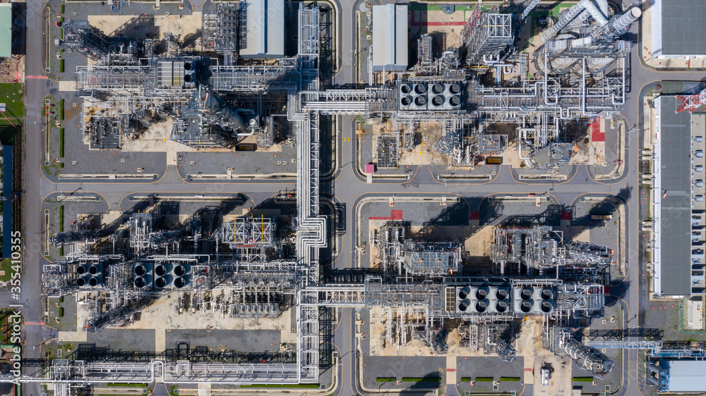 Aerial top view oil and gas refinery background, Business petrochemical industrial, Refinery oil and gas factory power and fuel energy, Ecosystem and healthy environment concepts.