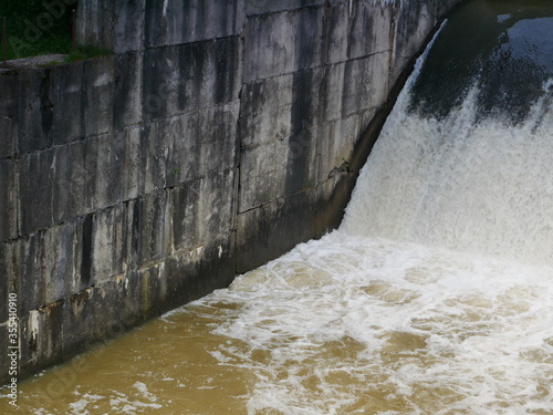 water flowing into the dam