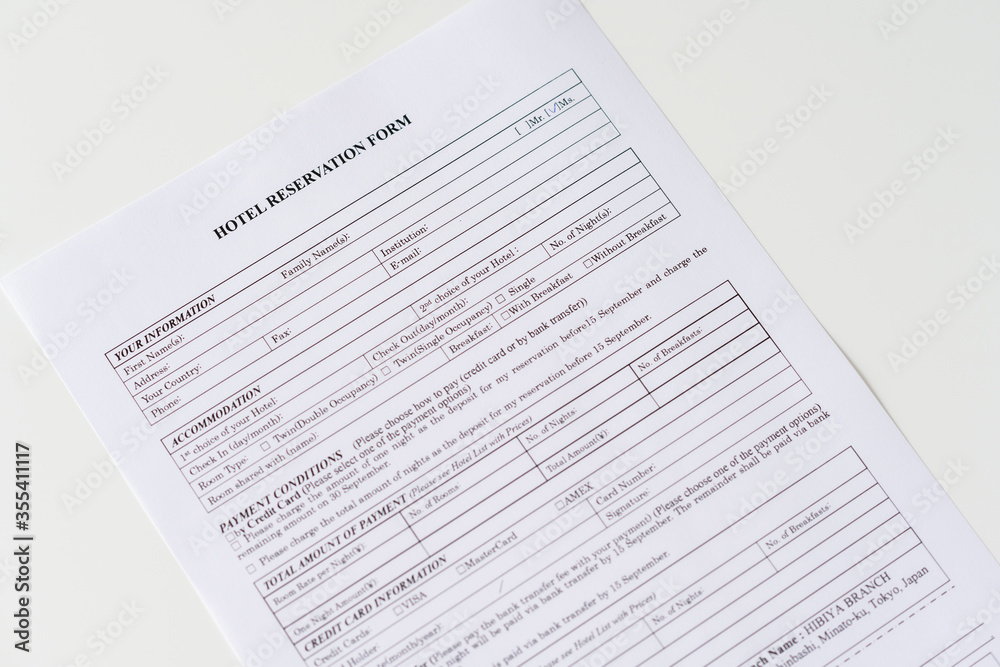 Hotel reservation form on the table at the office. Rental agreement apartment, house. Close up. Selective focus