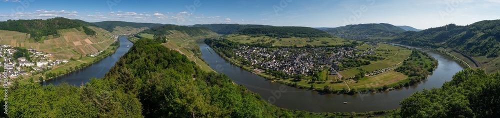 With the bike on the cycle path through the countryside along the river Moselle in Rhineland-Palatinate from Trier to Koblenz in summer