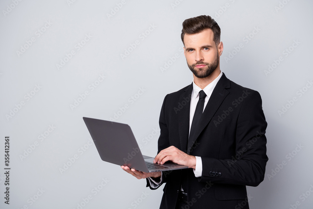 Portrait of serious confident cool entrepreneur man work with computer deal with start-up information clients wear classy outfit isolated over grey color background