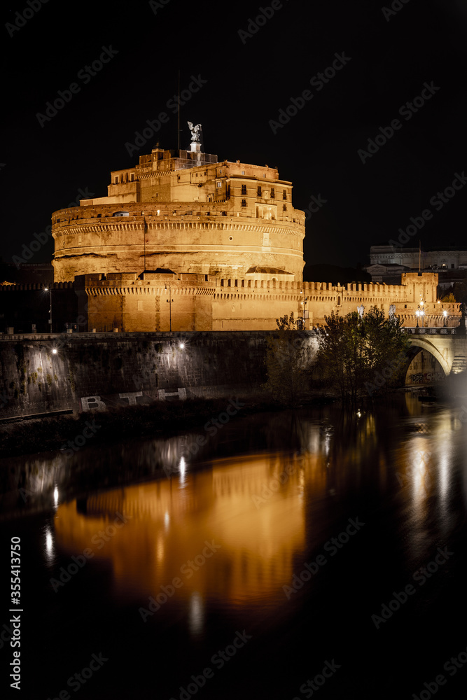 Castel Sant' Angelo in Rome by night on the Tiber River Italy