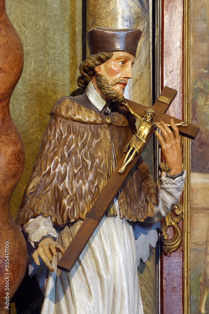 Obraz premium Saint John the Nepomuk statue on the altar of Saint Joseph in the parish church Visitation of the Virgin Mary in Garesnica, Croatia