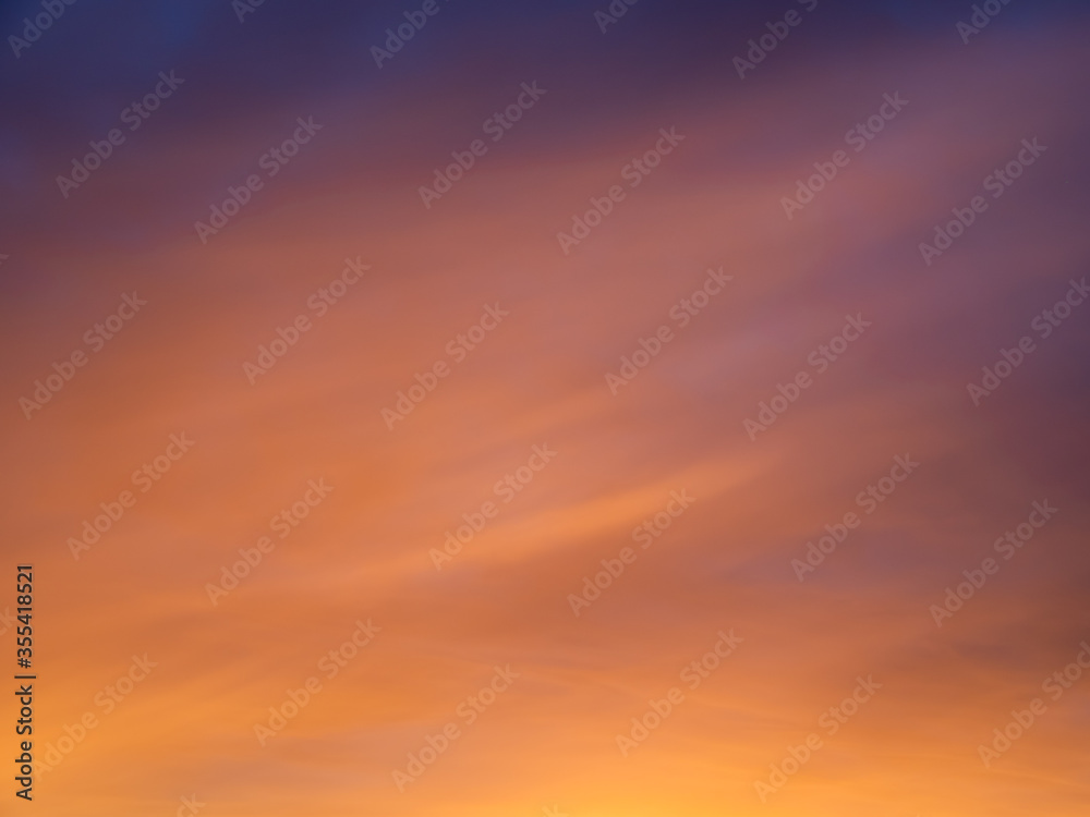 Beautiful sunset gradient from magenta sky to peachy clouds. Sunrise sky perfect for background and backdrop design.