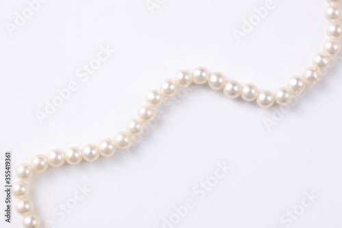 close up on pearl necklace isolated on white background with copy space for your text