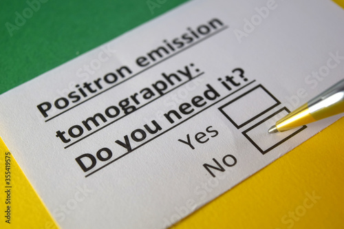 One person is answering question about positron emission tomography. photo