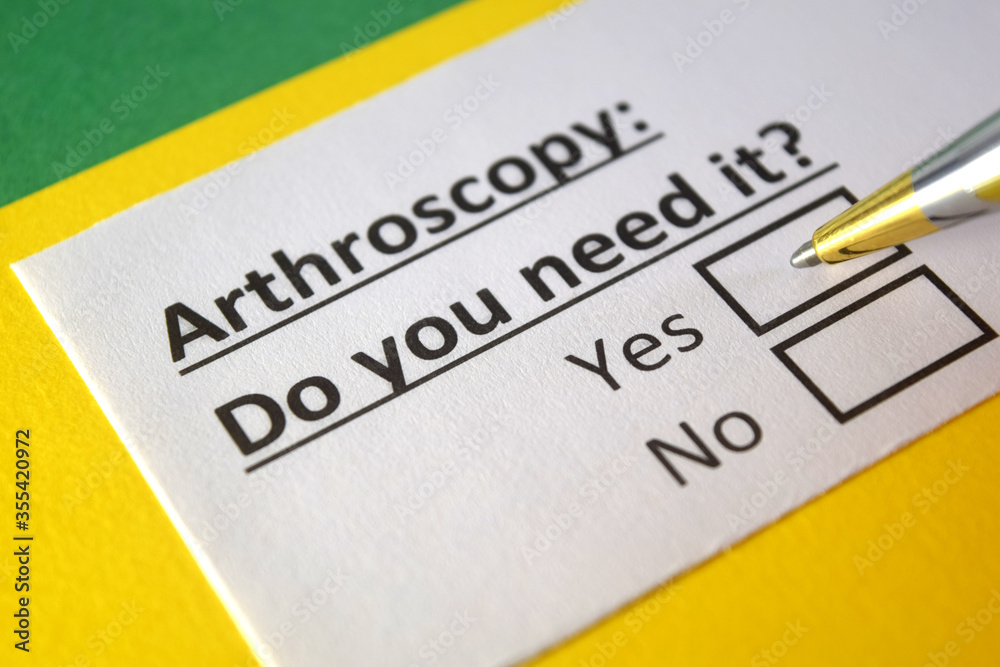 One person is answering question about arthroscopy. One person is answering question about arthroscopy.