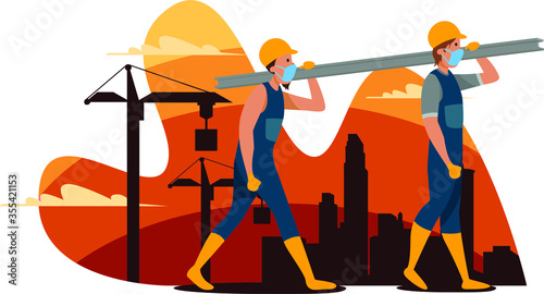 Two construction mans are carrying a material for building construction