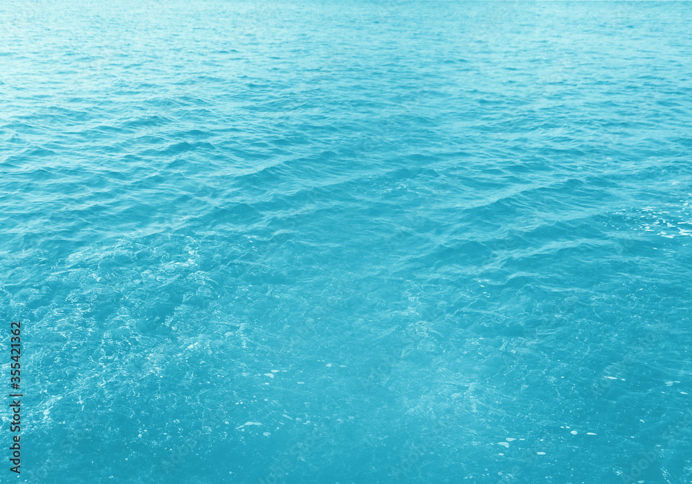 Obraz premium Abstract blue sea water with white foam for background, nature background concept