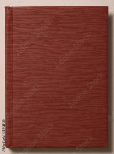 Book cover isolated on the white background. Leather covered book. Blank cover book. Faded cover of a vintage book.
