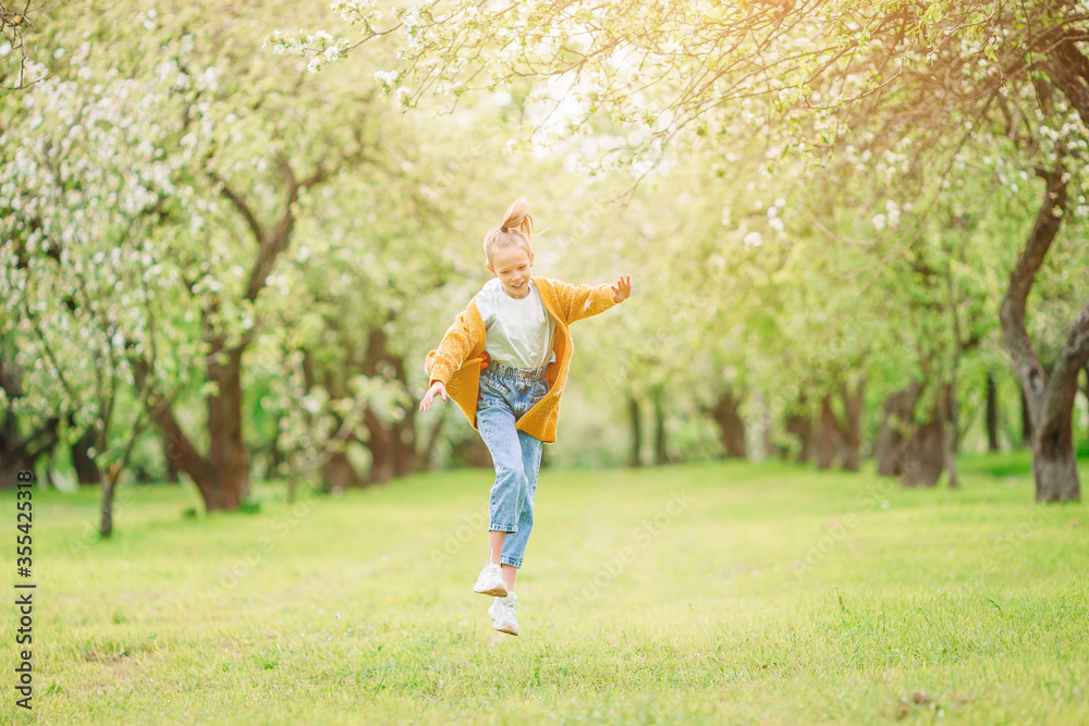 Little smiling girl playing in the park Little smiling girl playing in the park