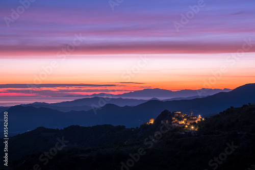 Dawn breaking over Speloncato and coastline of Corsica photo