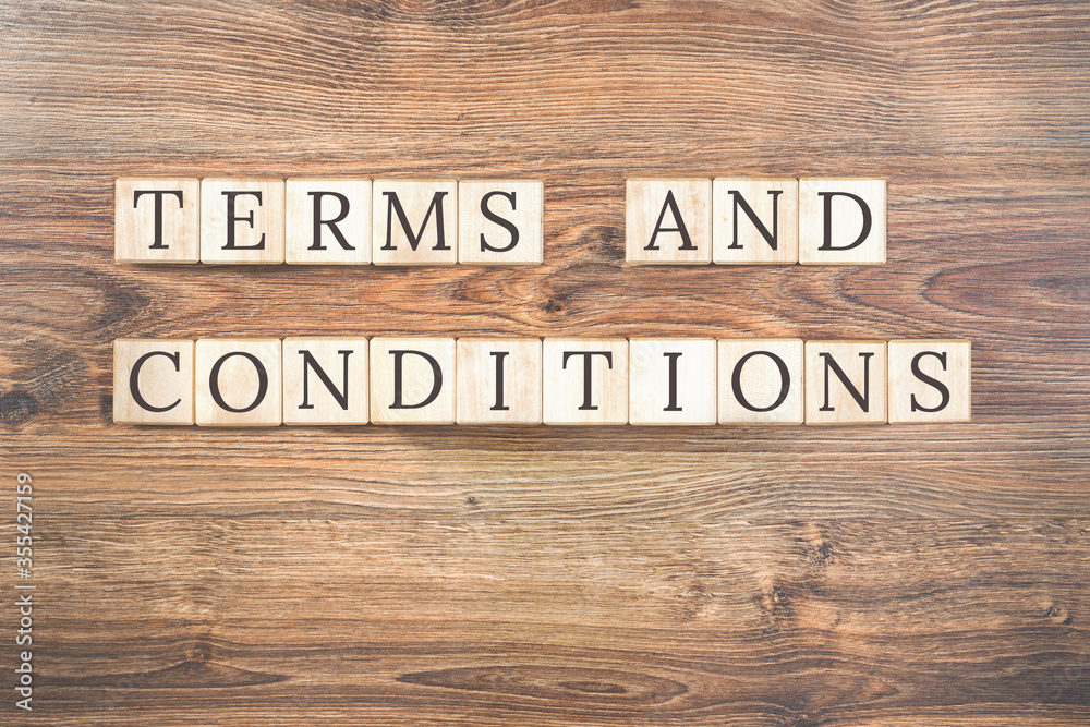 Terms and Conditions text on wooden background. Business concept. Terms and conditions of service or employment with copy space