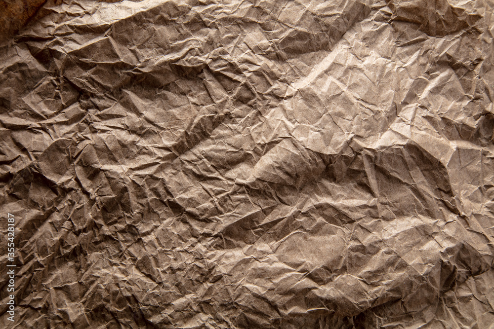 Fototapeta premium Crumpled paper as an abstract background.