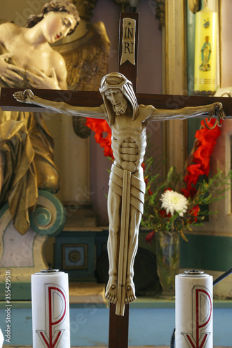 Crucifixion on the high altar in the parish church of St. Anthony the Hermit in Slavetic, Croatia photo