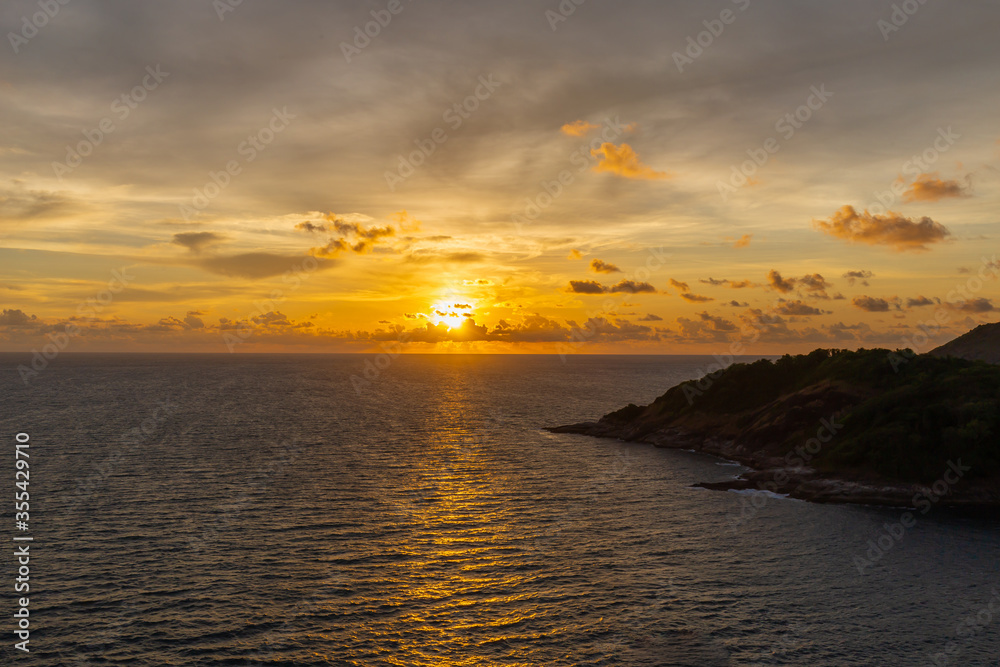 The sunset at Promthep Cape with mountains and sea in front. Is a popular tourist destination