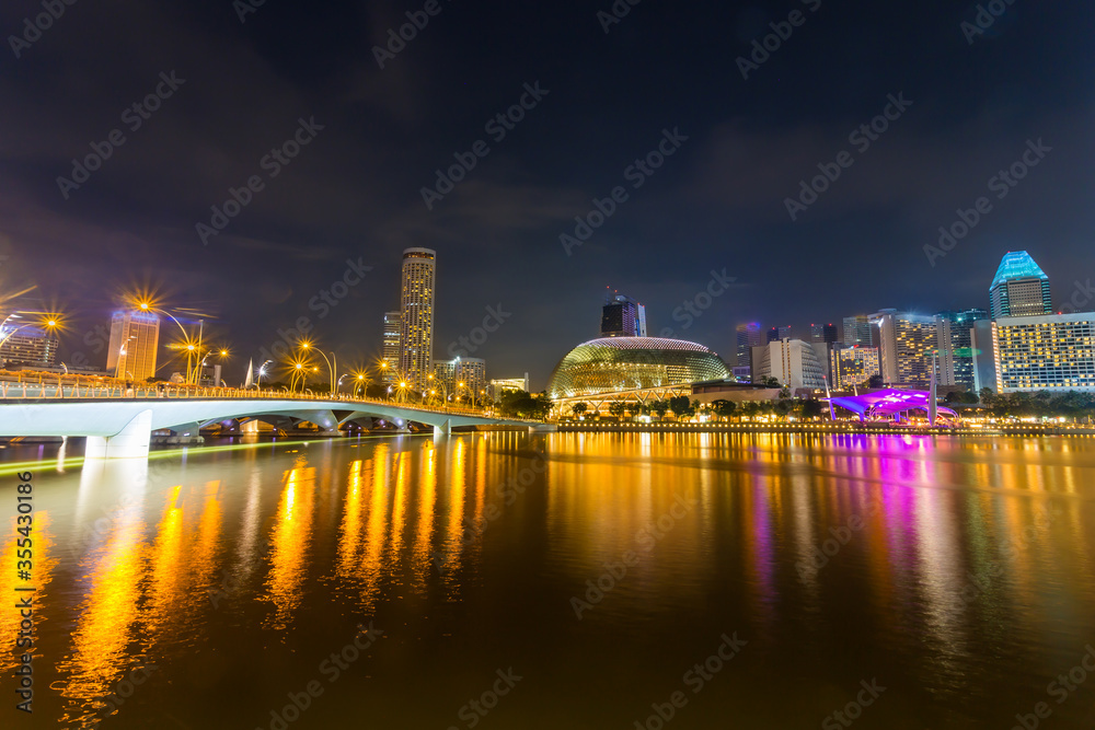 Cityscape of Singapore skyline at night time. Marina Bay is a bay located in the Central Area of Singapore