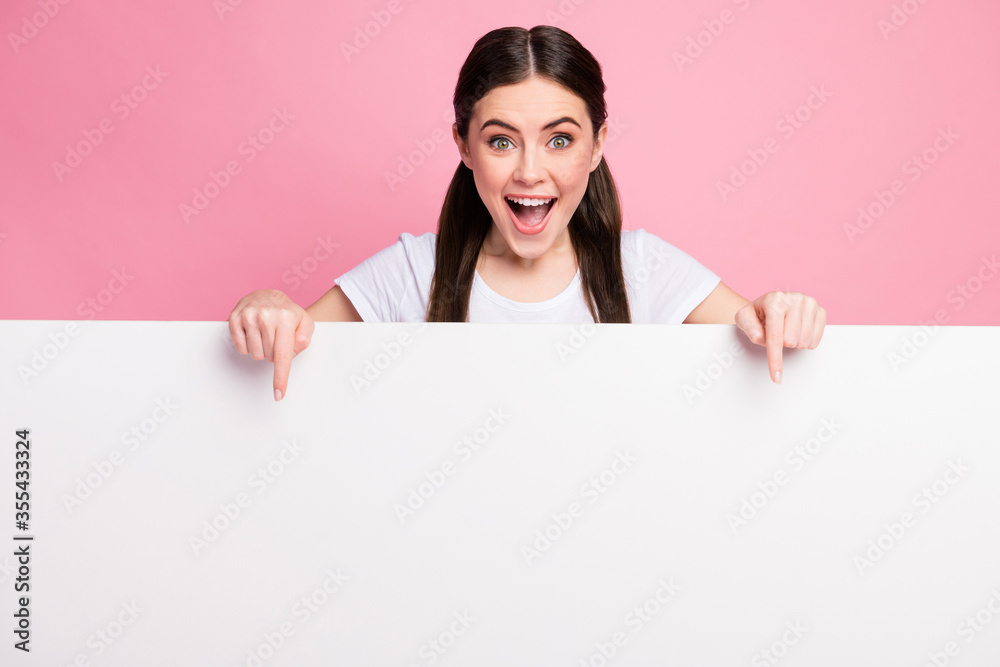 Portrait of her she nice attractive lovely charming glad amazed cheerful cheery girl showing copy empty blank space board promotion presentation isolated over pink pastel color background Portrait of her she nice attractive lovely charming glad amazed cheerful cheery girl showing copy empty blank space board promotion presentation isolated over pink pastel color background