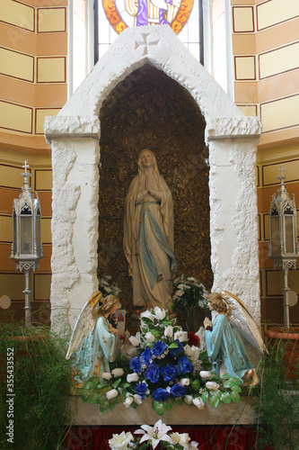 Altar of Our Lady of Lourdes in the parish church of Saint George in Desinic, Croatia photo