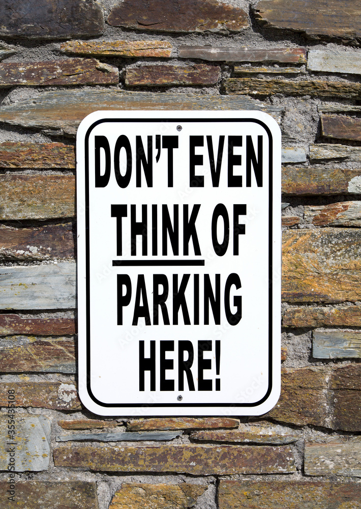 Obraz premium No Parking sign - on the wall of a private residence. Humorous no parking sign. 