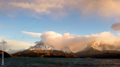 Mount Cerro Payne Grande and Torres del Paine at sunset time lapse. Nordenskjold Lake in Chile, Patagonia. photo